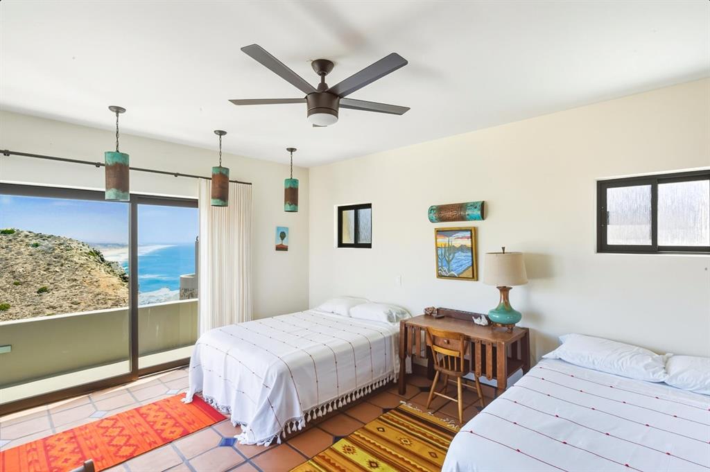 1 Arriba De Lane Roca, OUTSIDE OF THE US 99999 - Photo 33 of 40 a bedroom with a bed and wooden floor