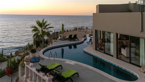 a kitchen with stainless steel appliances granite countertop a sink and a refrigerator
