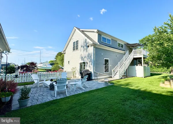 a view of an house with backyard porch and sitting area