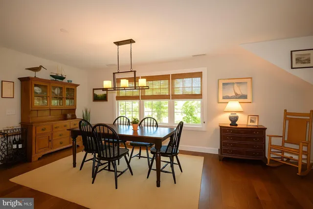 a view of a dining room with furniture and window