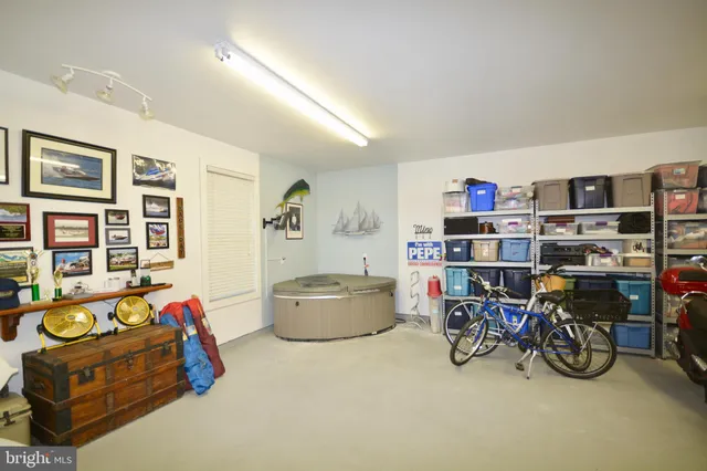 a living room with furniture and gym equipment
