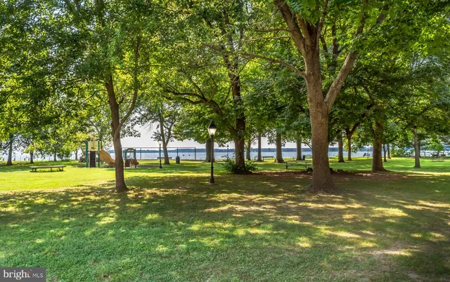 a view of swimming pool with a table and chairs