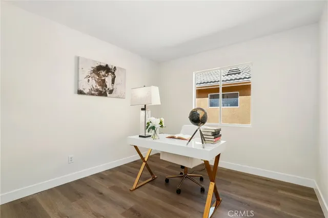a workspace with furniture and wooden floor