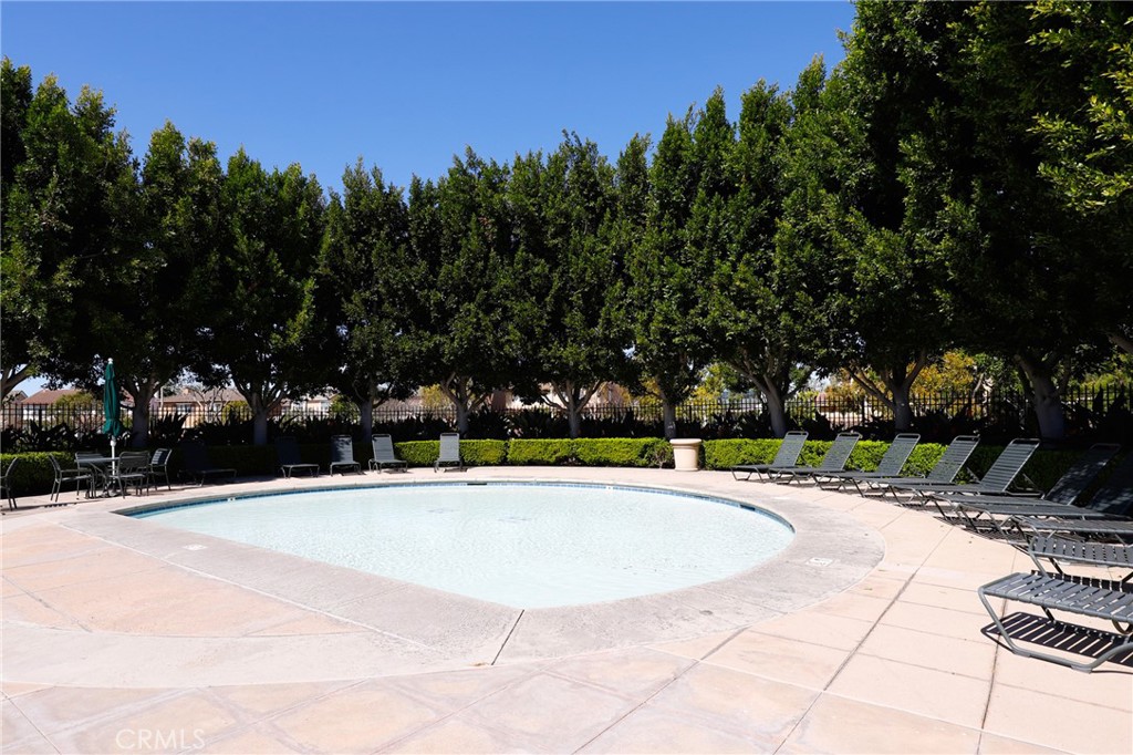 46 Nebraska Irvine, CA 92606 - Photo 31 of 36 a view of swimming pool with outdoor seating and trees in the background