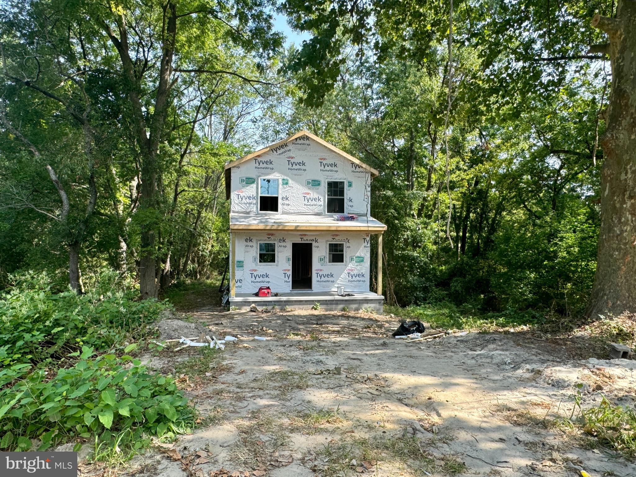 1115 West 6th Street Laurel, DE 19956 - Photo 6 of 34 a view of a house with a yard and large trees