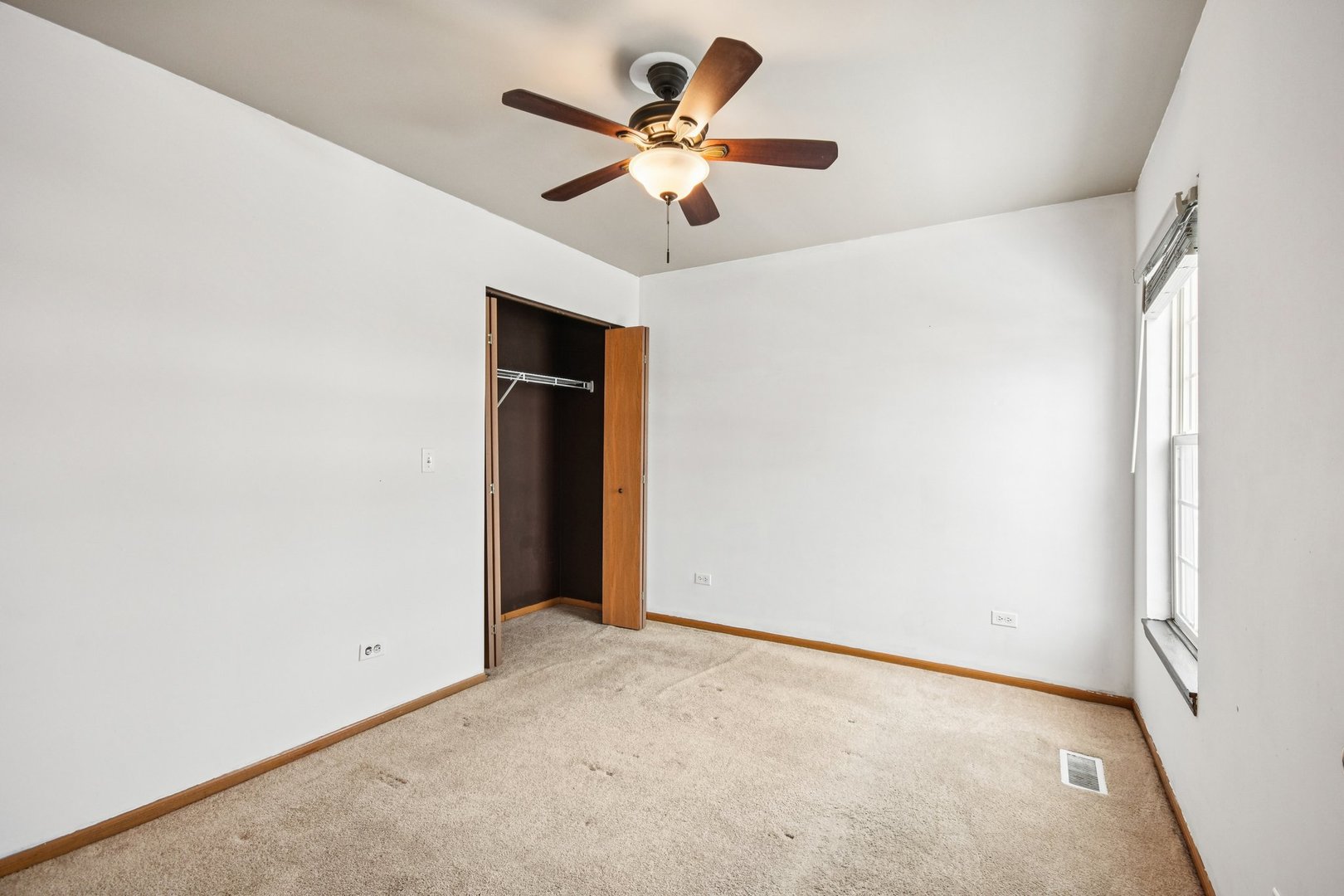 1524 Anderson Trail Zion, IL 60099 - Photo 17 of 22 an empty room with closet and a ceiling fan