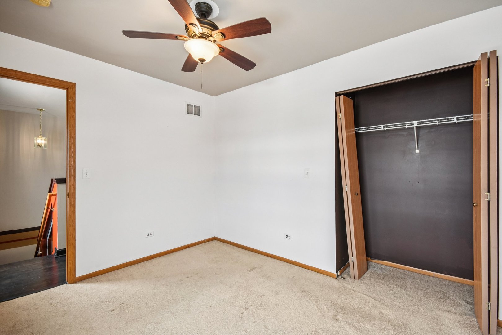 1524 Anderson Trail Zion, IL 60099 - Photo 18 of 22 an empty room with closet and a ceiling fan