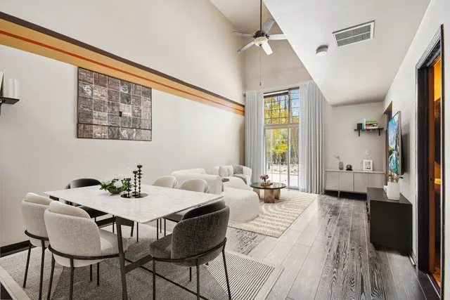 a view of a dining room with furniture window and wooden floor