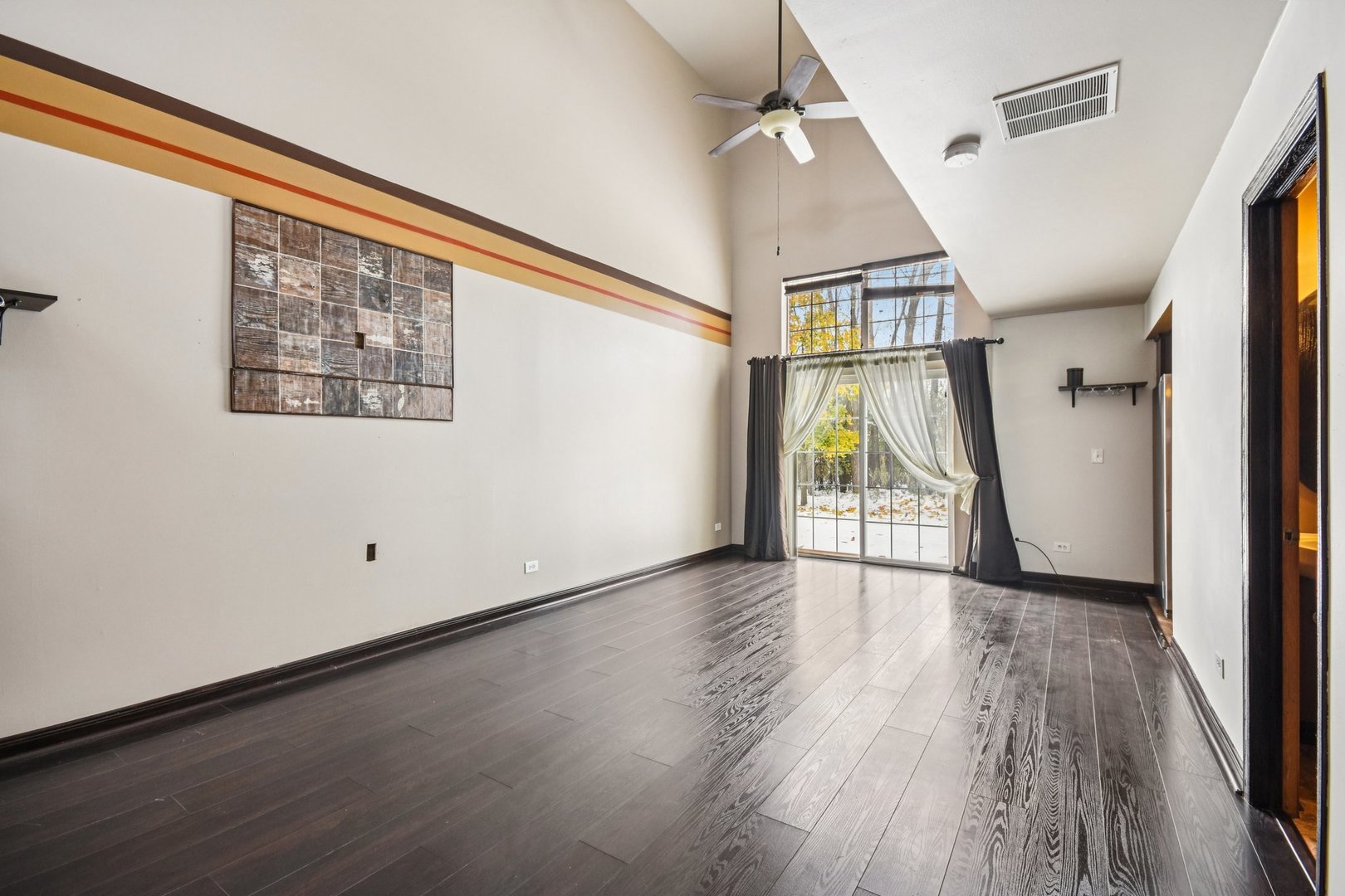1524 Anderson Trail Zion, IL 60099 - Photo 3 of 22 an empty room with wooden floor and door
