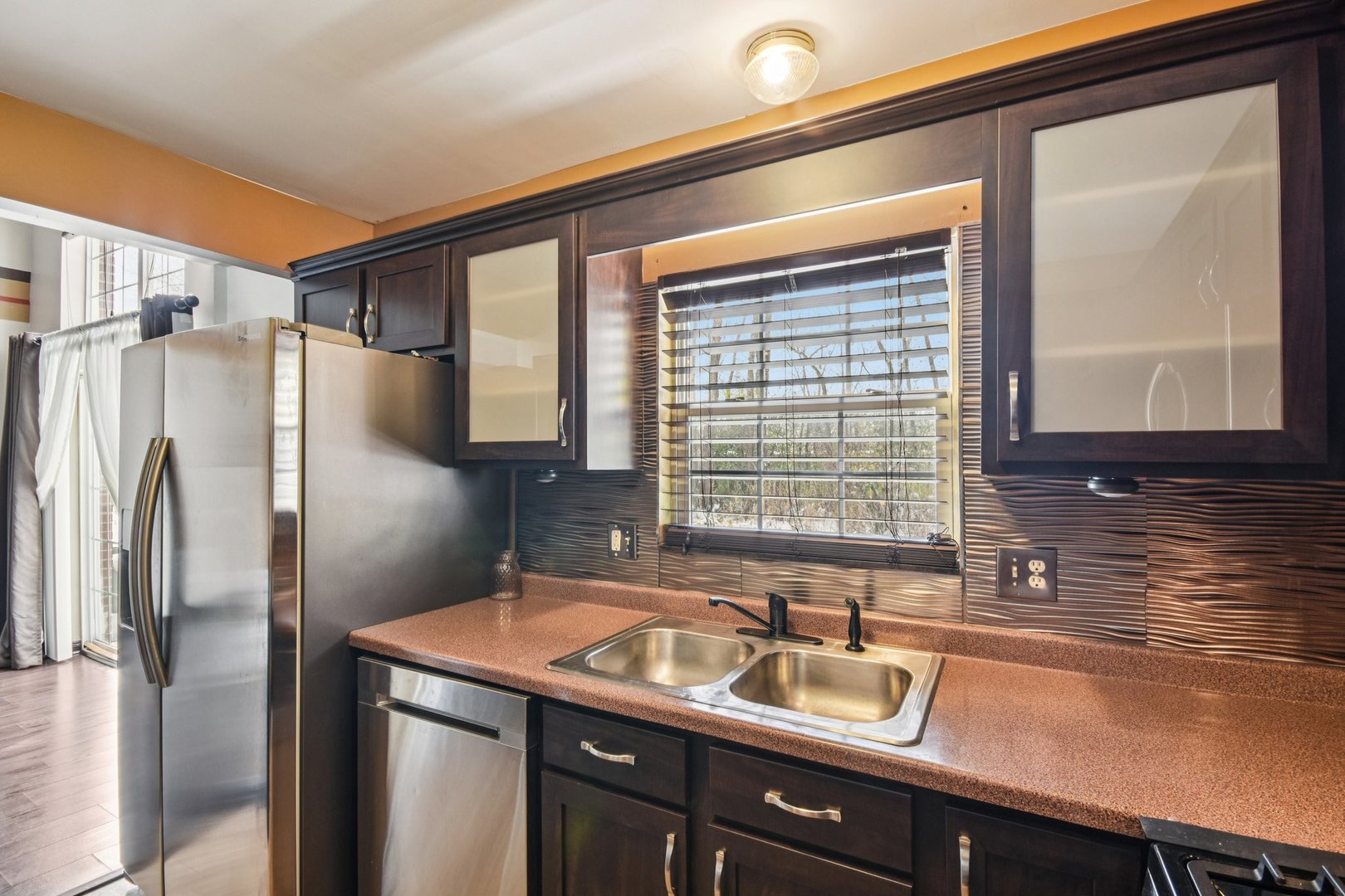 1524 Anderson Trail Zion, IL 60099 - Photo 7 of 22 a kitchen with a sink and a refrigerator