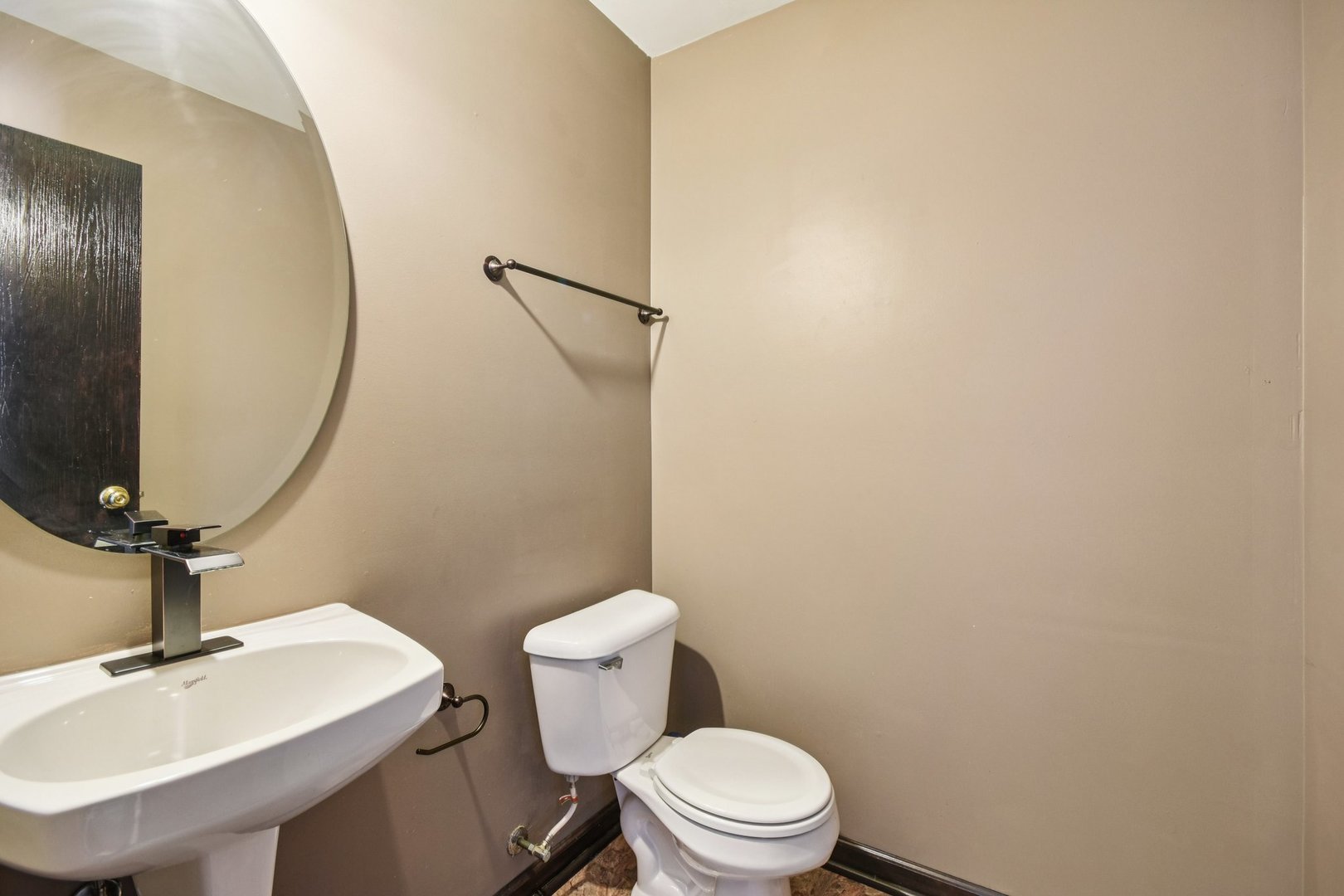 1524 Anderson Trail Zion, IL 60099 - Photo 9 of 22 a bathroom with a toilet a sink and mirror