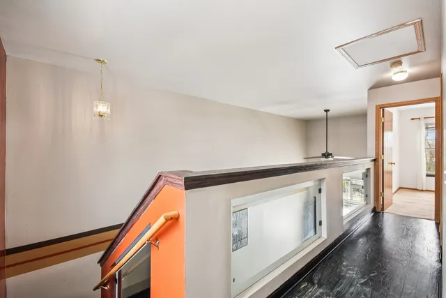 a bedroom with a large bed and a potted plant