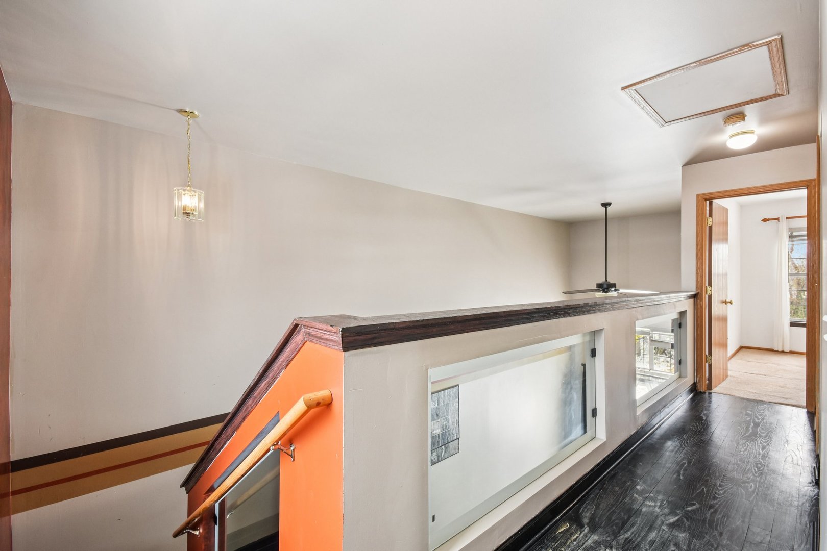 1524 Anderson Trail Zion, IL 60099 - Photo 10 of 22 a hallway with white cabinets and wooden floor