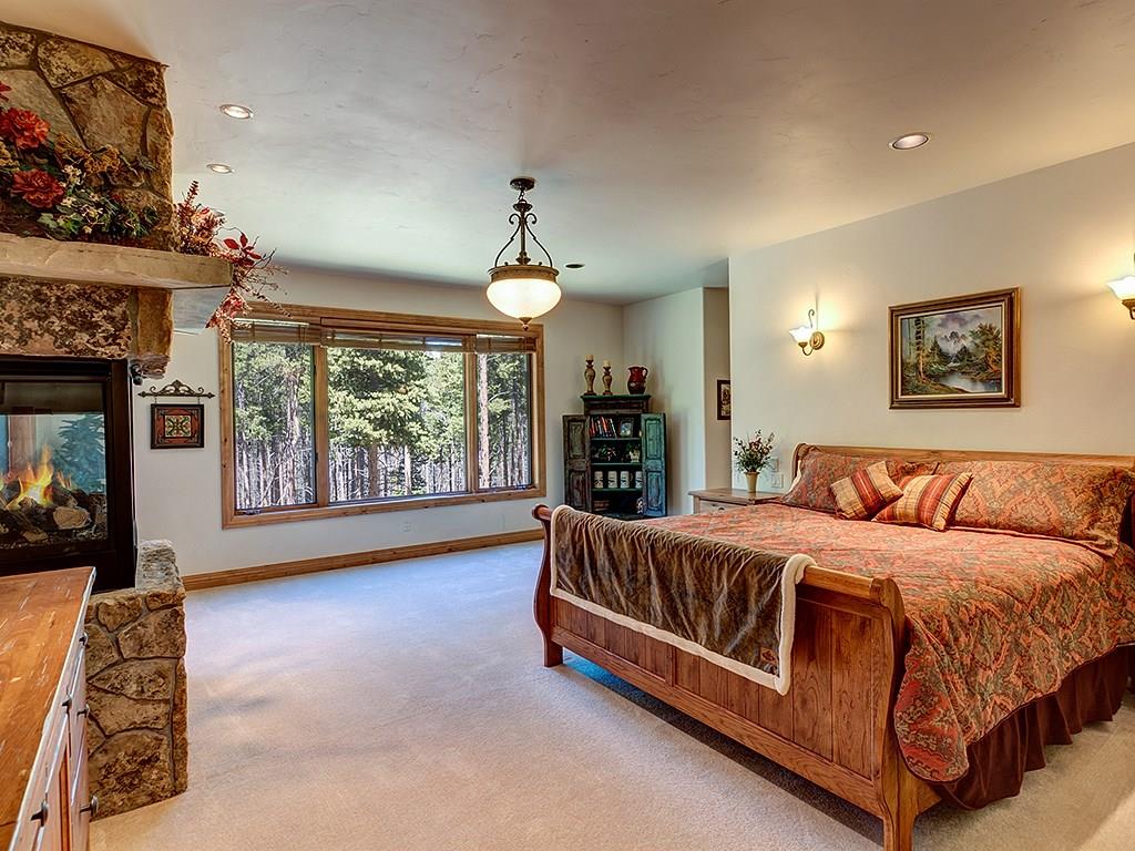 677 White Cloud Drive Breckenridge, CO 80424 - Photo 12 of 25 a spacious bedroom with a bed and a large window