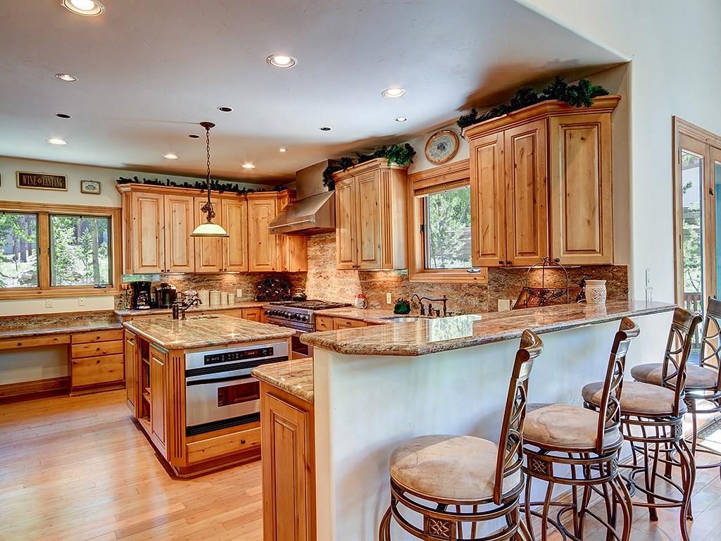 677 White Cloud Drive Breckenridge, CO 80424 - Photo 5 of 25 a kitchen with a stove a sink and a refrigerator