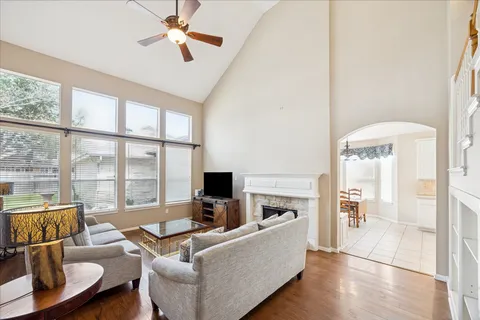 a spacious bathroom with a granite countertop sink mirror and a shower