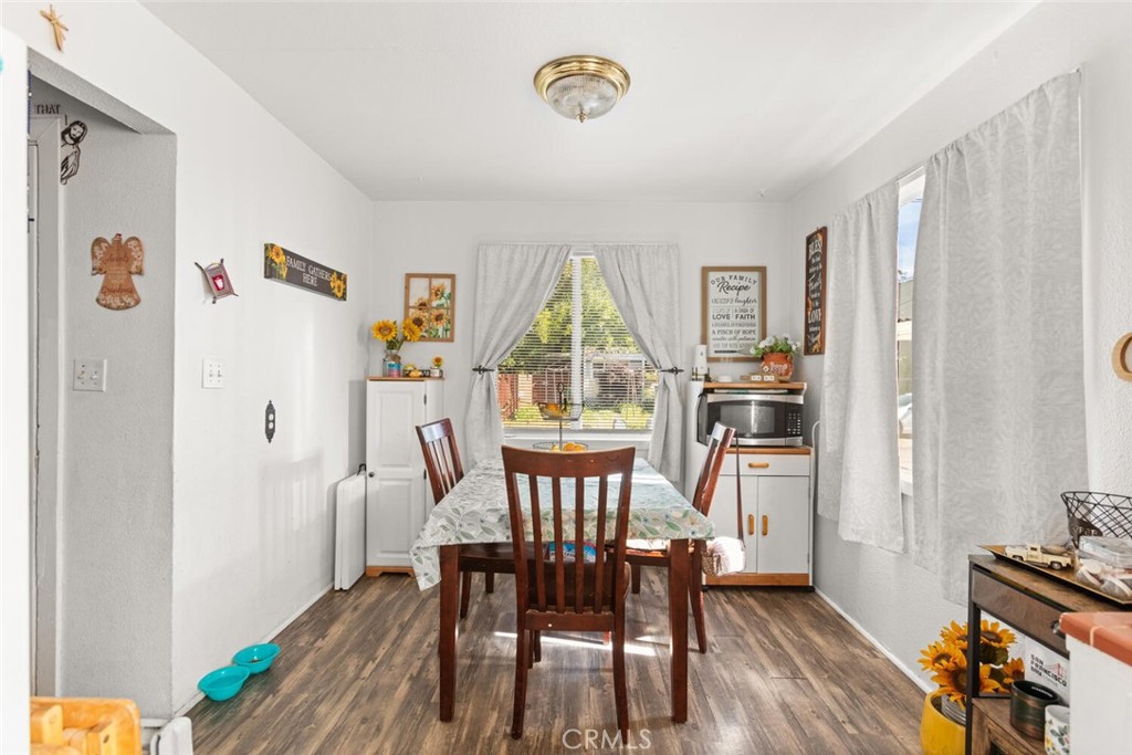 1012 Poppy Street Chico, CA 95928 - Photo 12 of 37 a view of a dining room with furniture window and wooden floor