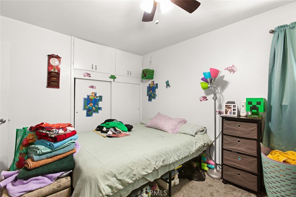 1012 Poppy Street Chico, CA 95928 - Photo 14 of 37 a bedroom with a bed and a dresser