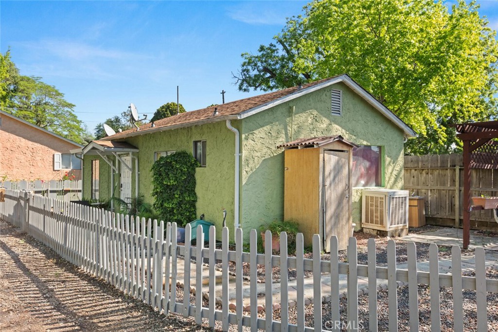 1012 Poppy Street Chico, CA 95928 - Photo 19 of 37 a view of a house with wooden fence next to a yard