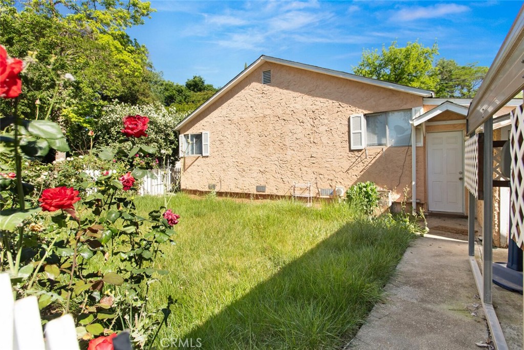 1012 Poppy Street Chico, CA 95928 - Photo 29 of 37 a view of a house with a yard and garden