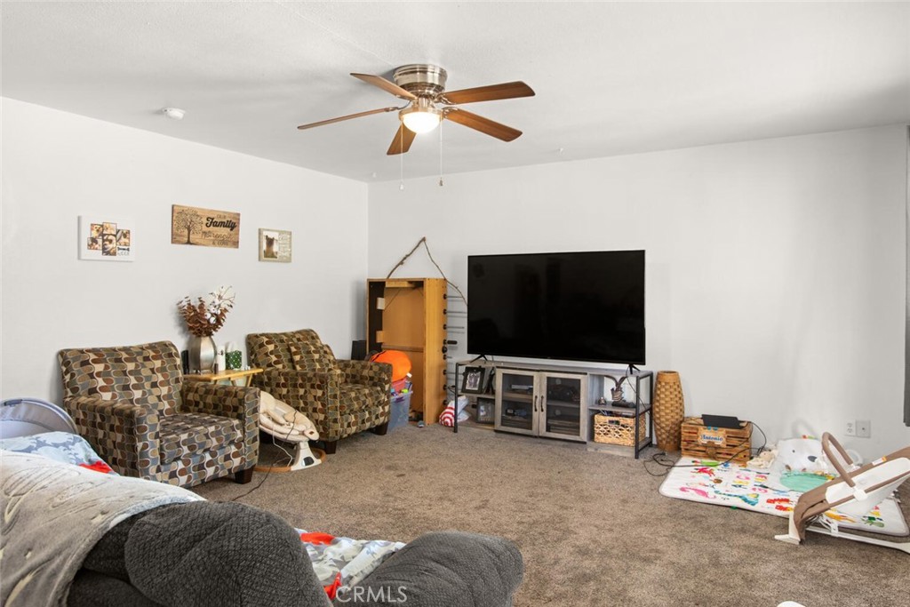 1012 Poppy Street Chico, CA 95928 - Photo 6 of 37 a living room with furniture and a flat screen tv