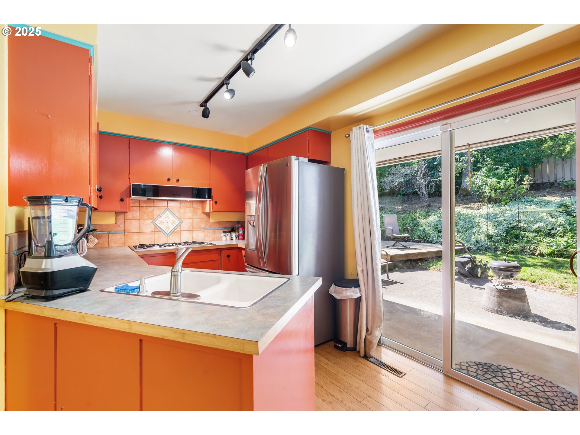 2120 West 23rd Avenue Eugene, OR 97405 - Photo 12 of 35 a kitchen with a refrigerator a stove and a sink