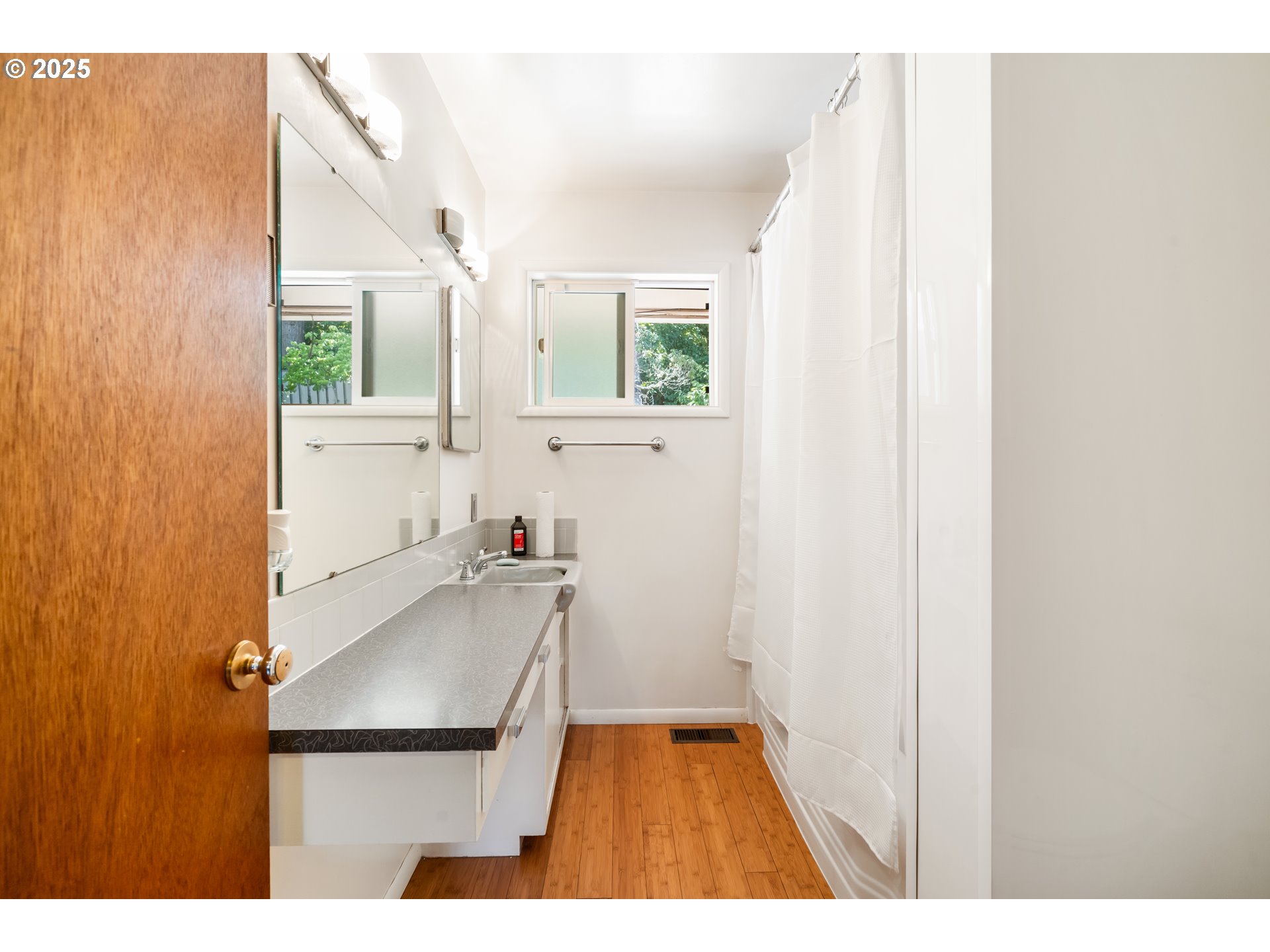 2120 West 23rd Avenue Eugene, OR 97405 - Photo 18 of 35 a bathroom with a sink and a window