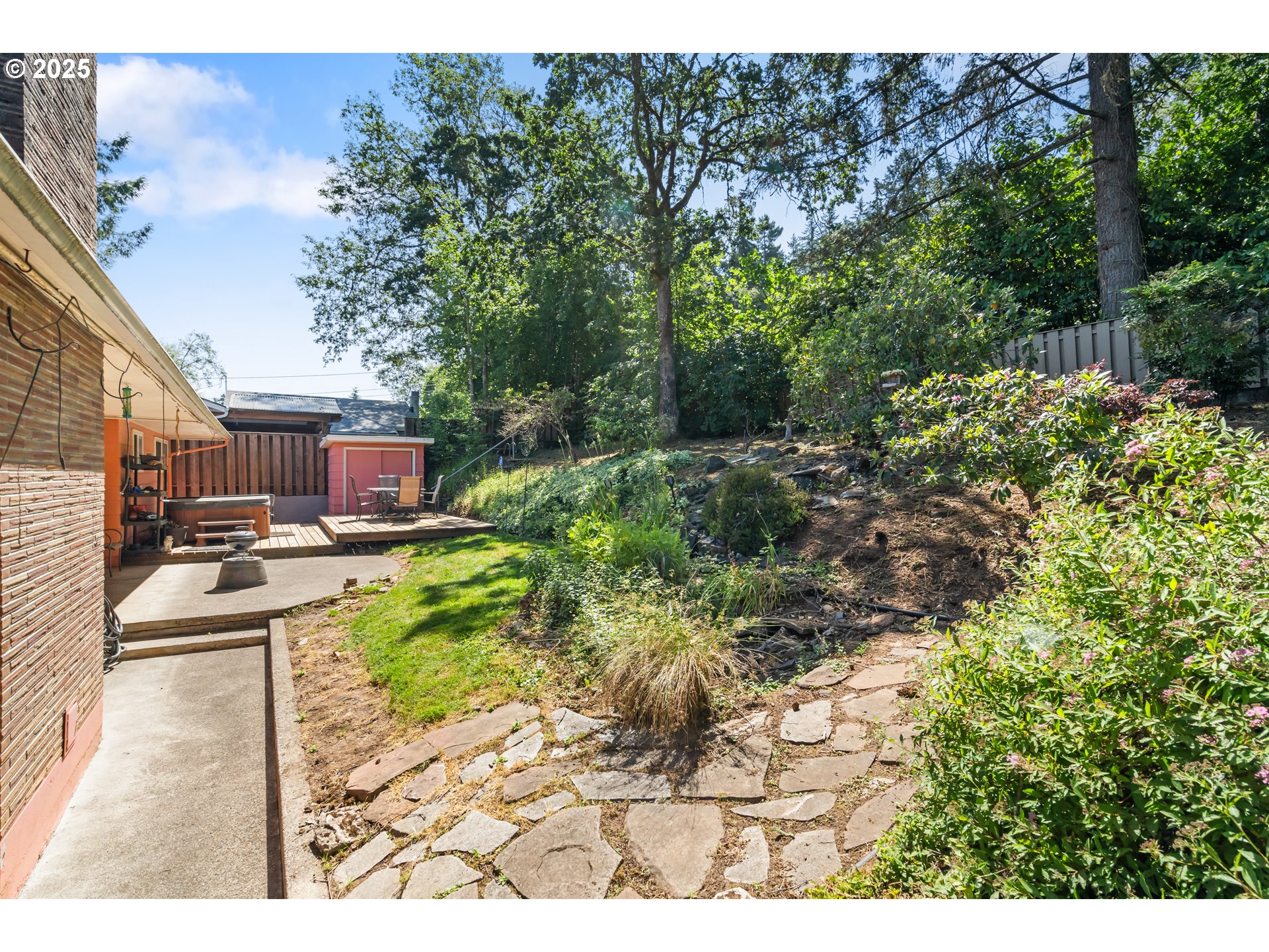 2120 West 23rd Avenue Eugene, OR 97405 - Photo 33 of 35 a view of a backyard with plants and a patio