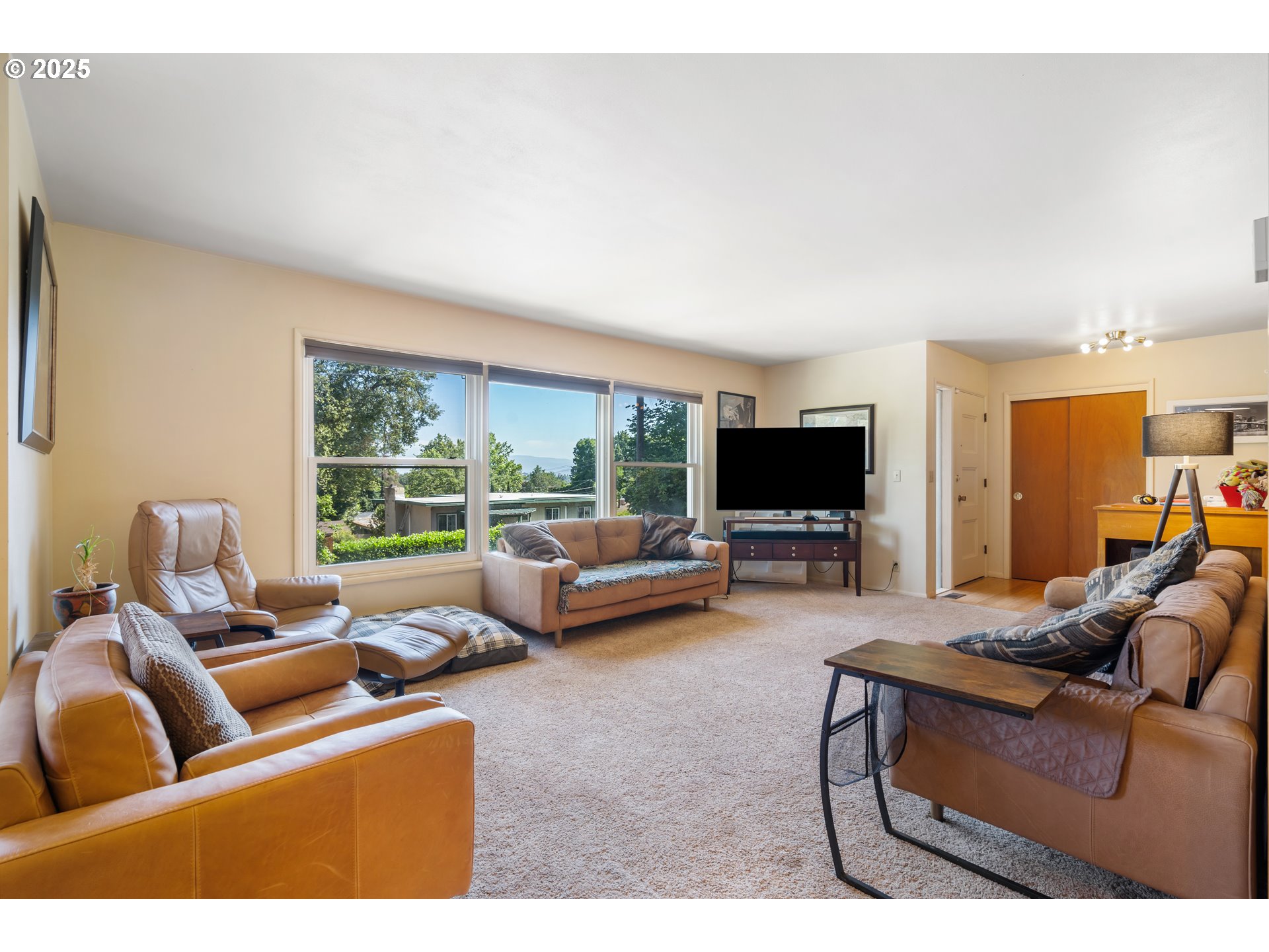 2120 West 23rd Avenue Eugene, OR 97405 - Photo 7 of 35 a living room with furniture and a flat screen tv