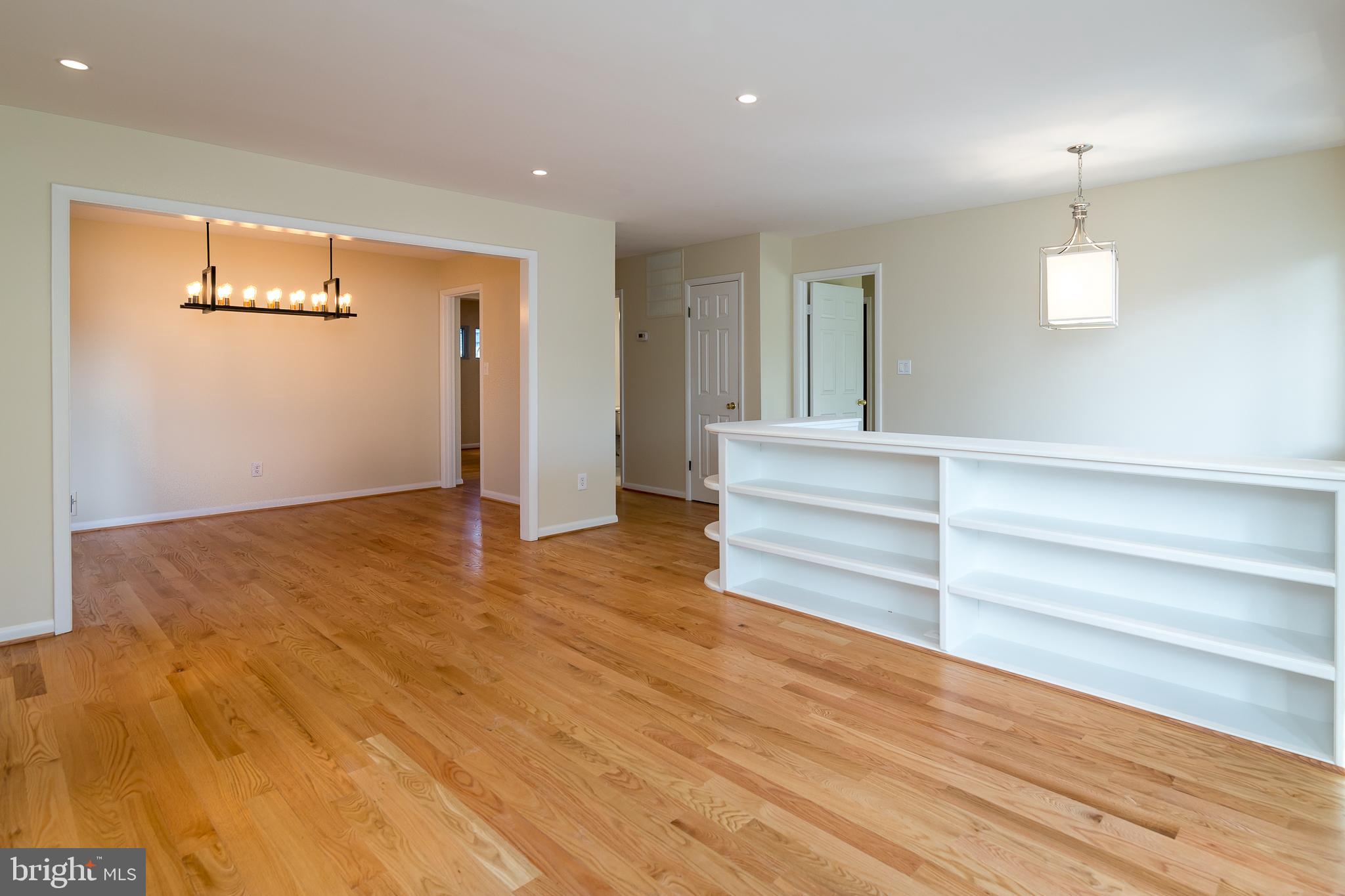 6862 St Albans Road McLean, VA 22101 - Photo 7 of 29 an empty room with wooden floor closet and windows