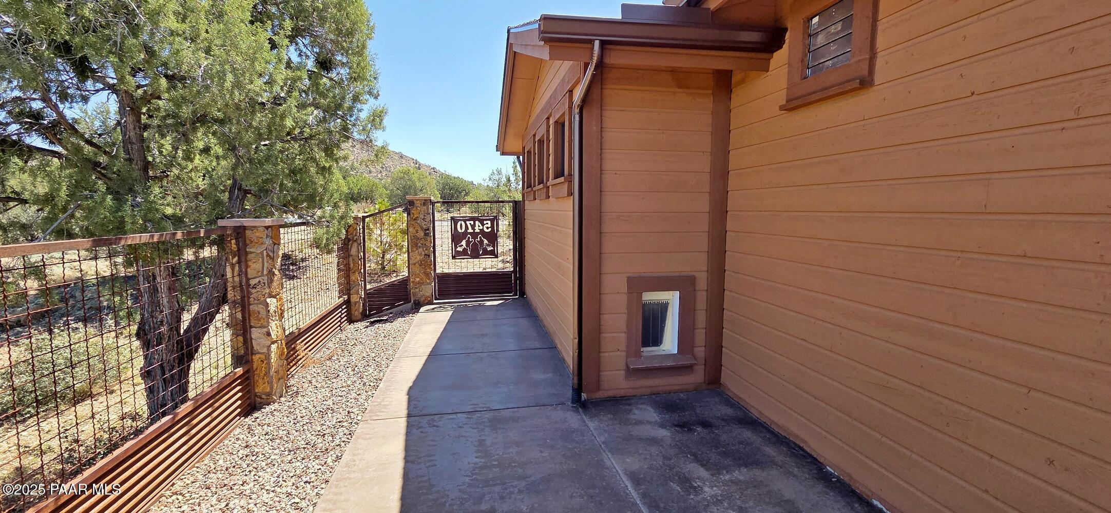 5470 West Three Forks Road Prescott, AZ 86305 - Photo 54 of 61 Side Yard with Dog Door