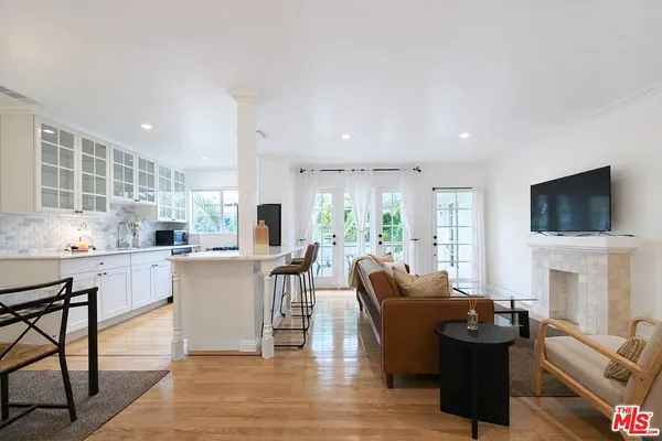 a living room with fireplace furniture and a flat screen tv