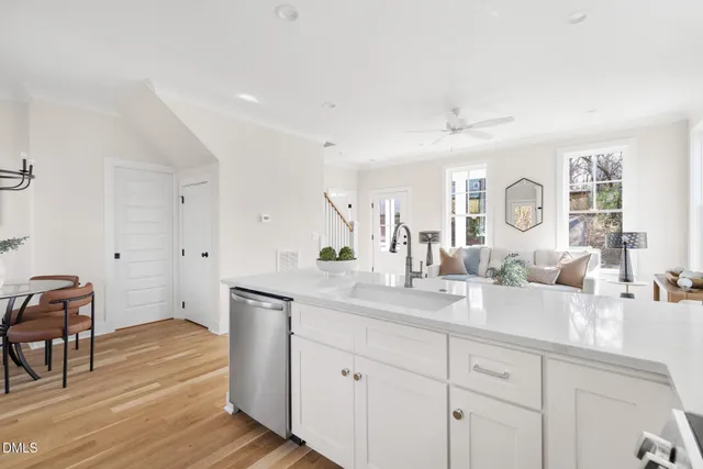 a spacious bathroom with double vanity a a mirror a vanity and a shower