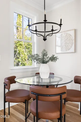 a dining room with a table and chairs