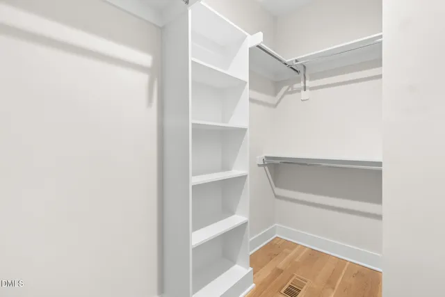 a view of an empty walk in closet