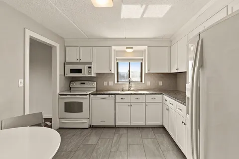 a view of a livingroom with furniture and wooden floor