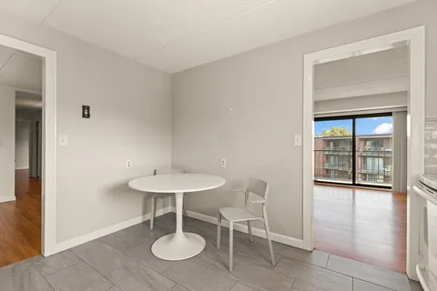 a view of a bathroom with wooden floor