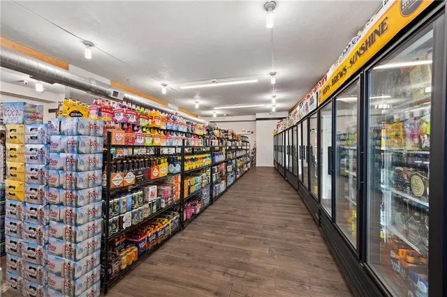a view of an entryway with wooden floor