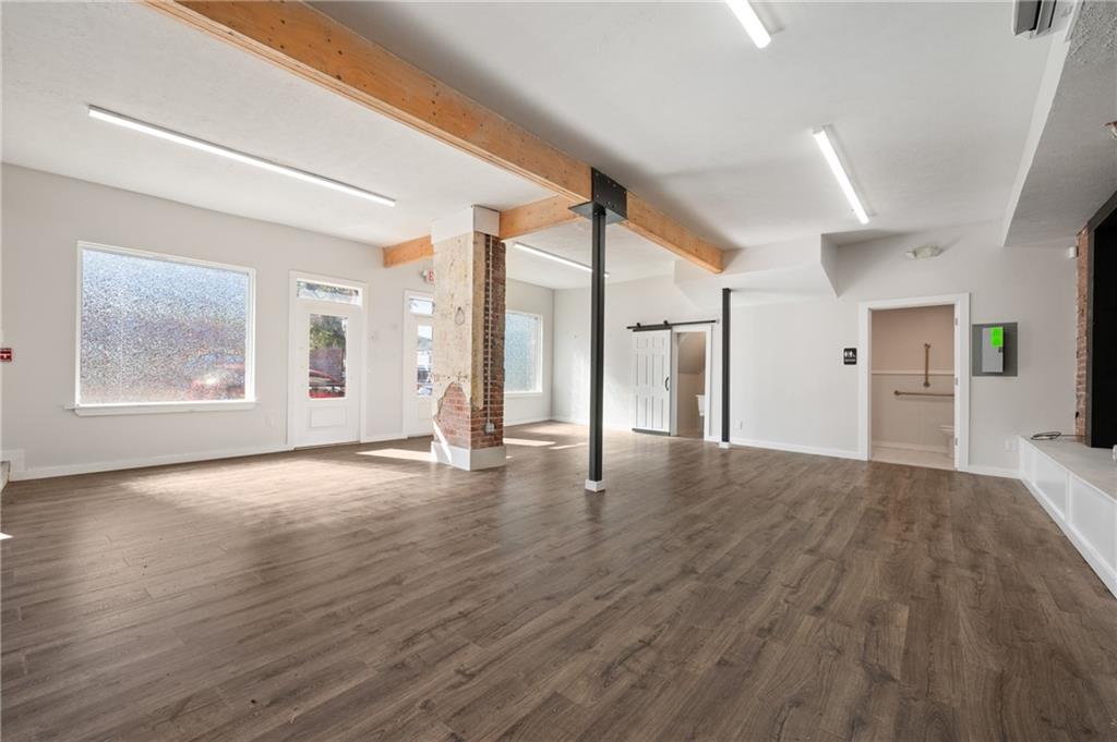 200 East 8th Avenue Homestead, PA 15120 - Photo 25 of 50 a view of an empty room with window and wooden floor