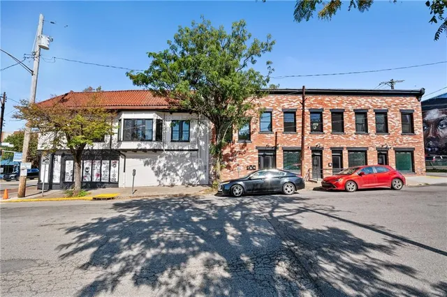a front view of a building with street view