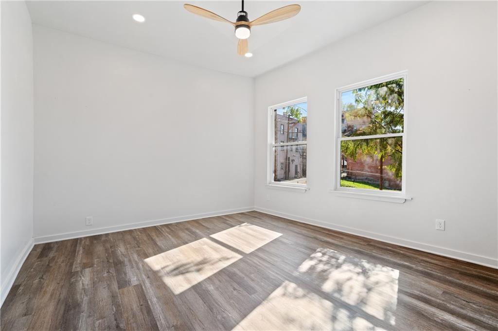 200 East 8th Avenue Homestead, PA 15120 - Photo 36 of 50 wooden floor in an empty room with a window