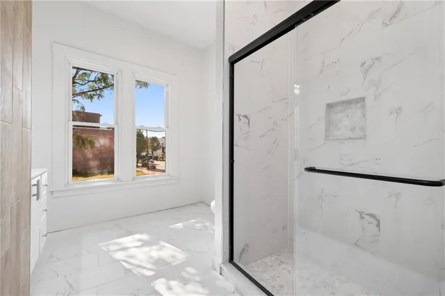 a kitchen with a sink and refrigerator