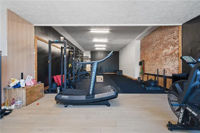 a view of a livingroom with workspace and a window