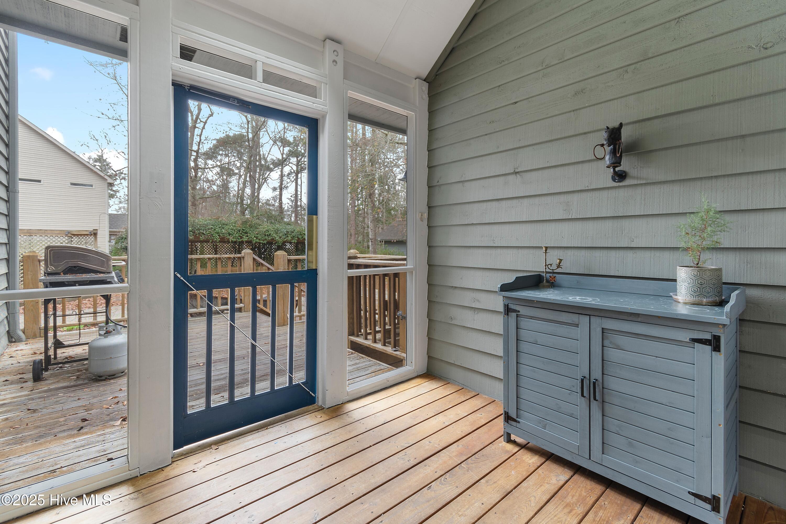 103 Ridge Road Hampstead, NC 28443 - Photo 40 of 60 Screened in Porch out to Driveway (access from Flex Space)