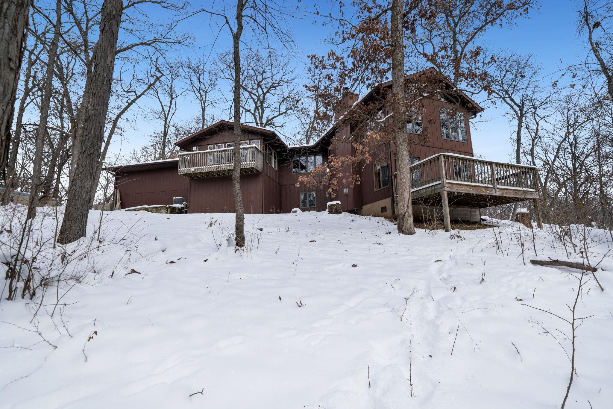 a backyard of a house with large trees