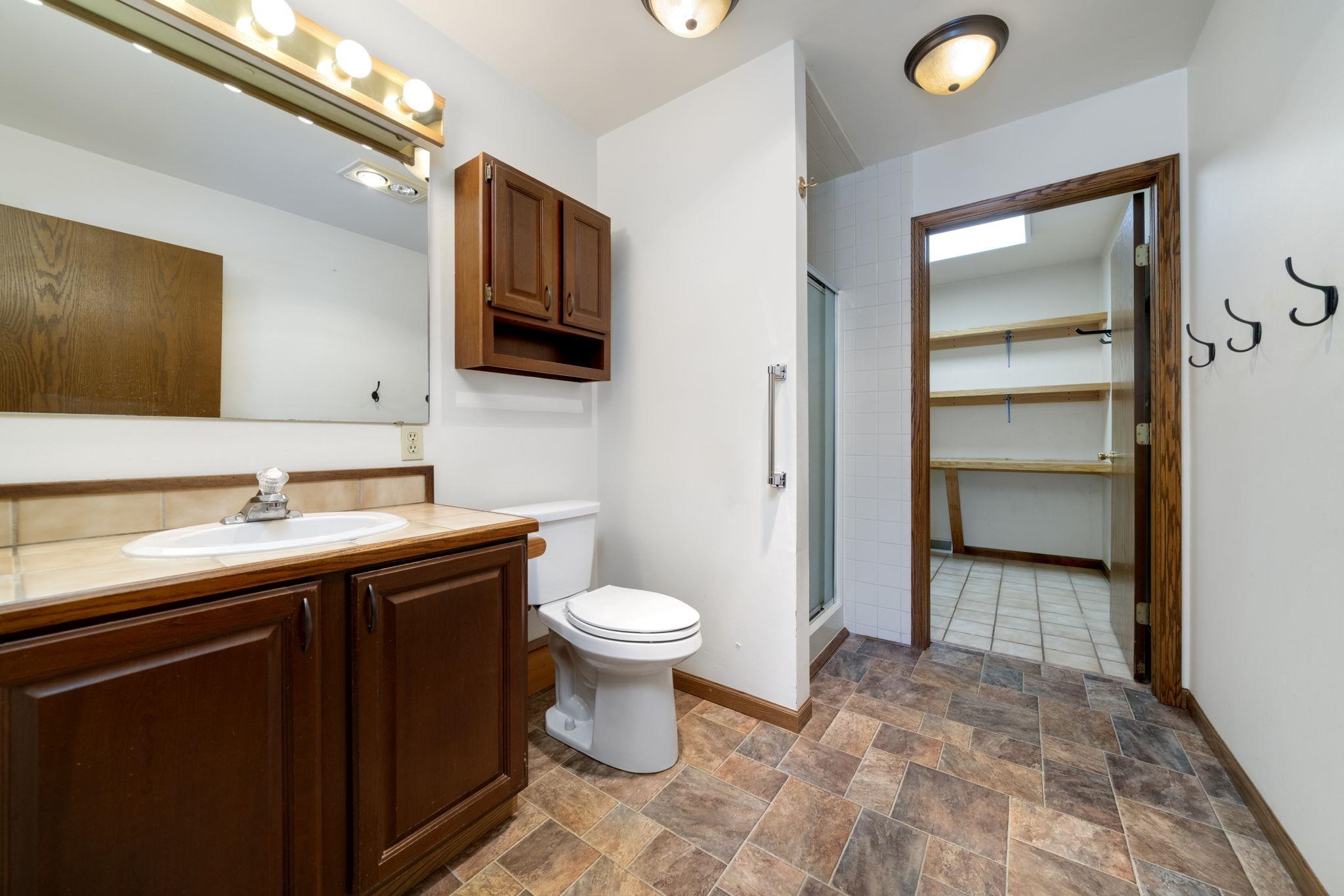 1203 West Mud Creek Road Oregon, IL 61061 - Photo 26 of 67 a bathroom with a sink and a mirror
