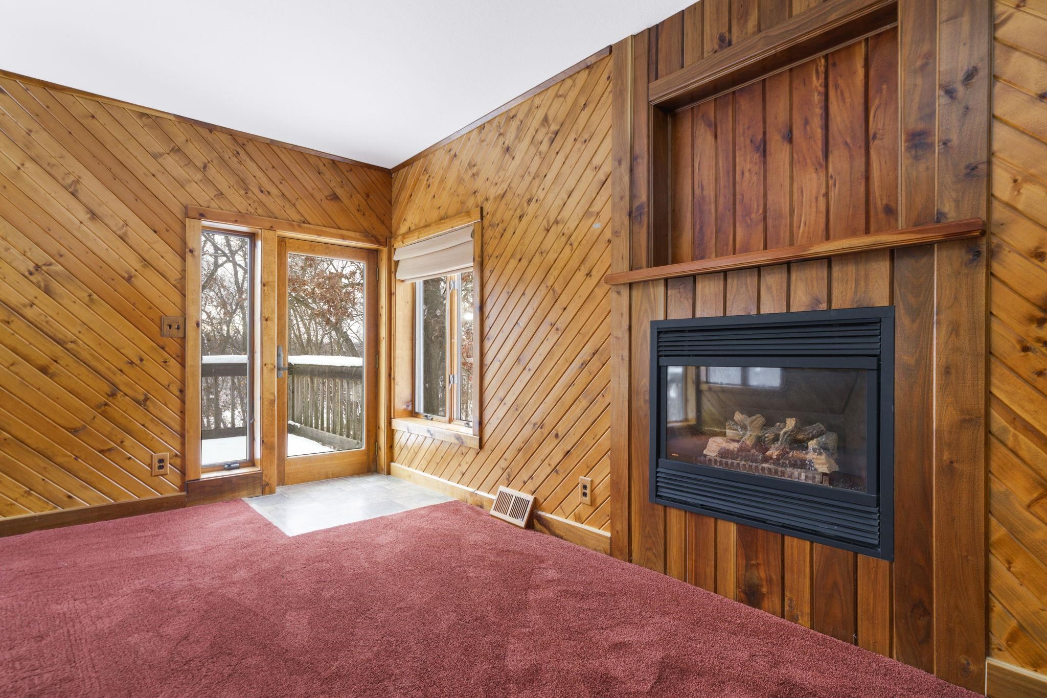 1203 West Mud Creek Road Oregon, IL 61061 - Photo 27 of 67 a view of an empty room with a fireplace and a window
