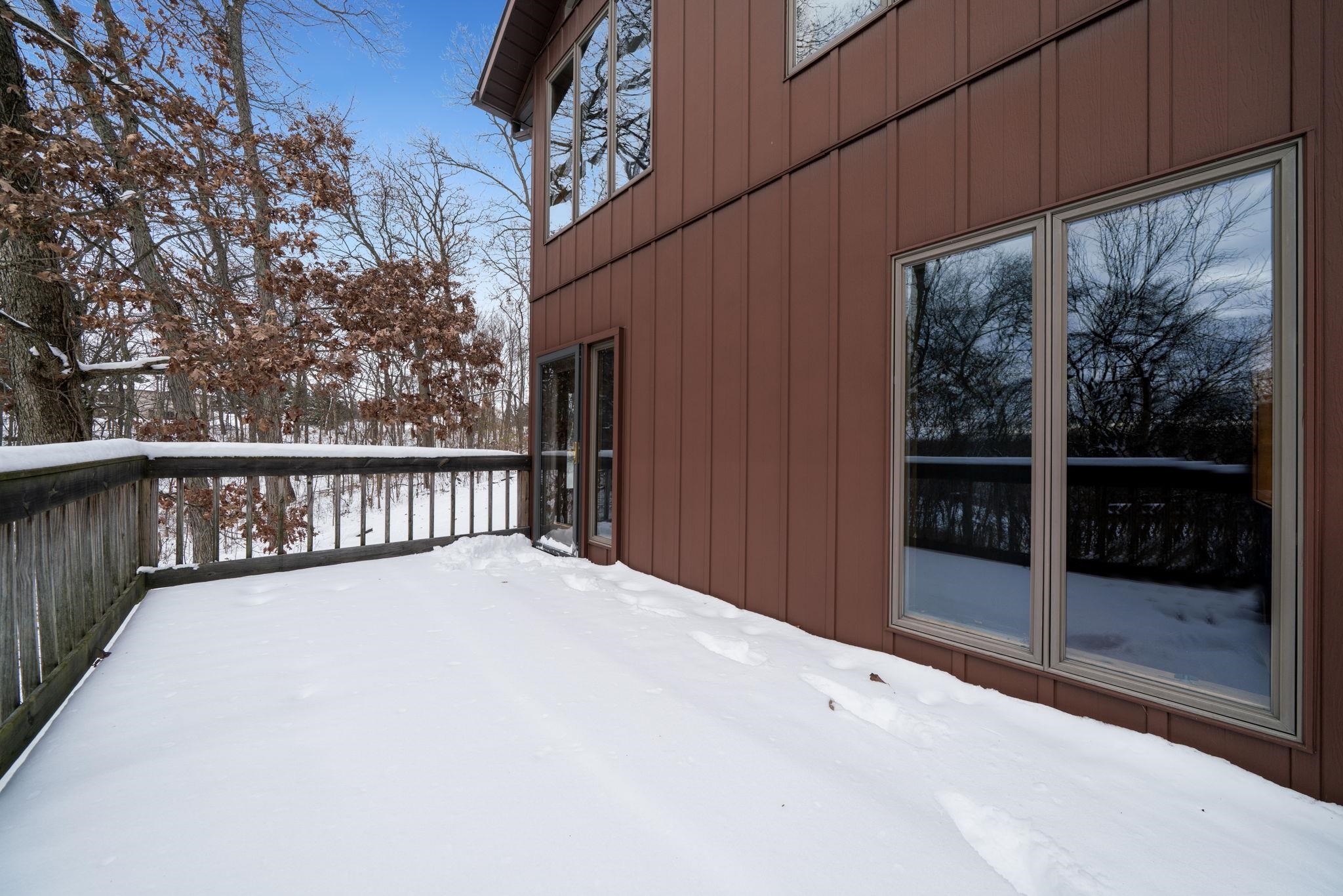 1203 West Mud Creek Road Oregon, IL 61061 - Photo 29 of 67 a view of balcony with floor to ceiling window and wooden fence