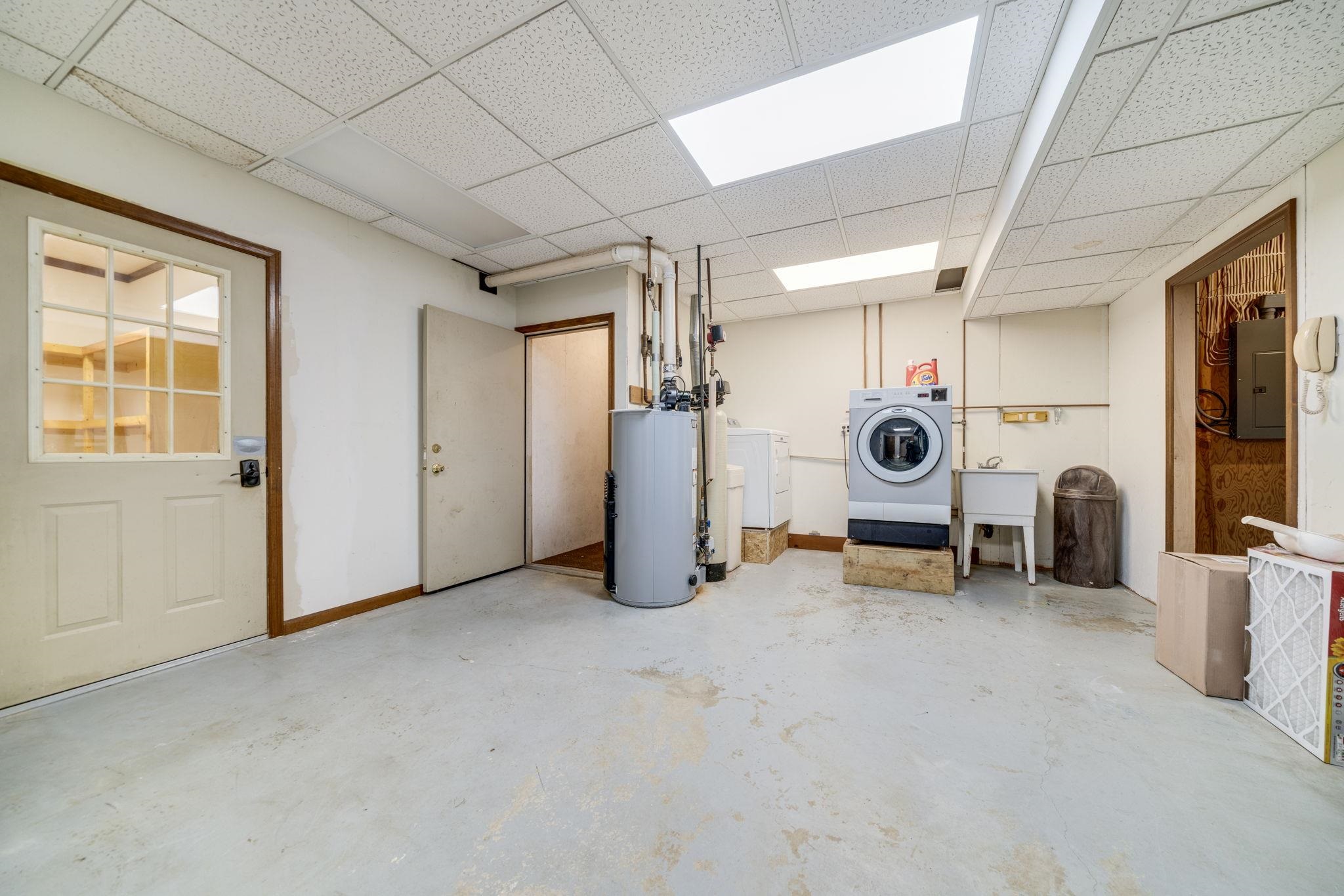 1203 West Mud Creek Road Oregon, IL 61061 - Photo 32 of 67 a view of a livingroom with a tv and a large window