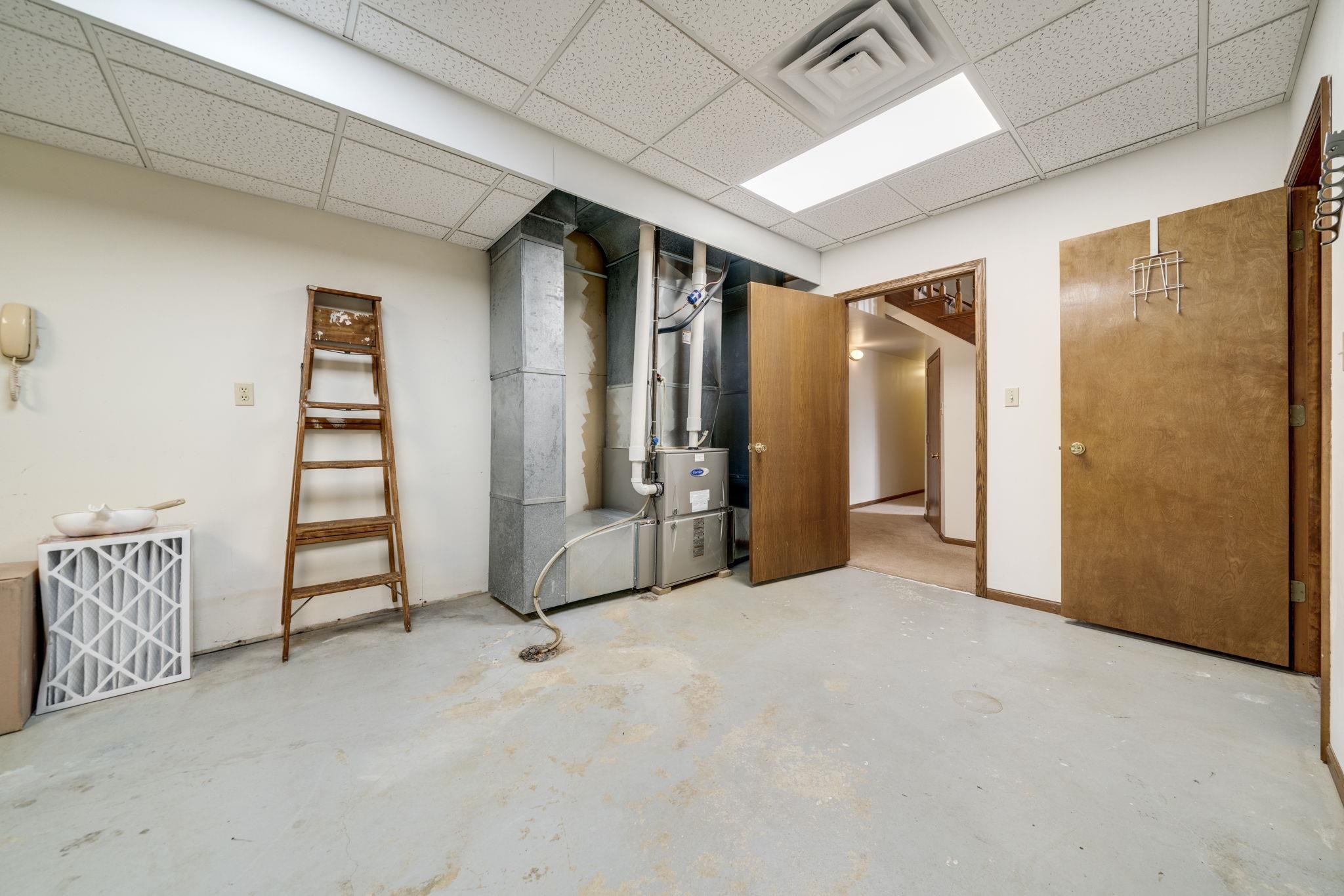 1203 West Mud Creek Road Oregon, IL 61061 - Photo 33 of 67 a view of an empty room with stairs and furniture
